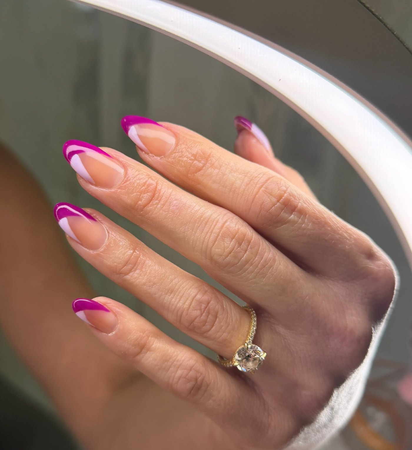 Magenta French tip gel nails on almond shape, done at Guapa! Nail Studio